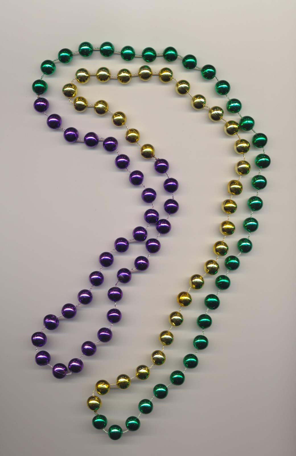 Plastic imitation bead necklace in the traditional Mardi Gras colors of purple, green and gold, Mardi Gras Parade 1996, New Orleans, length 49'' 124cm.