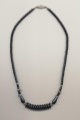 Necklace made of hematine and silver color metal beads, China, 1990, length 25'' 50cm.