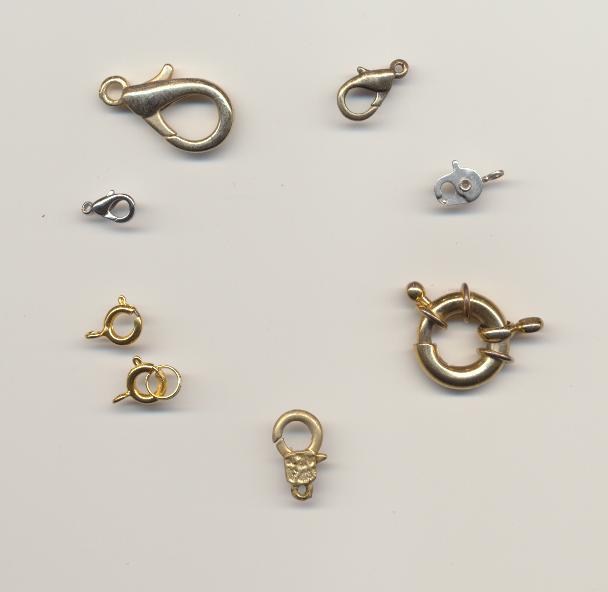 Clasps of different style: bronze, silver and gold colored metal spring-ring and lobster claw.