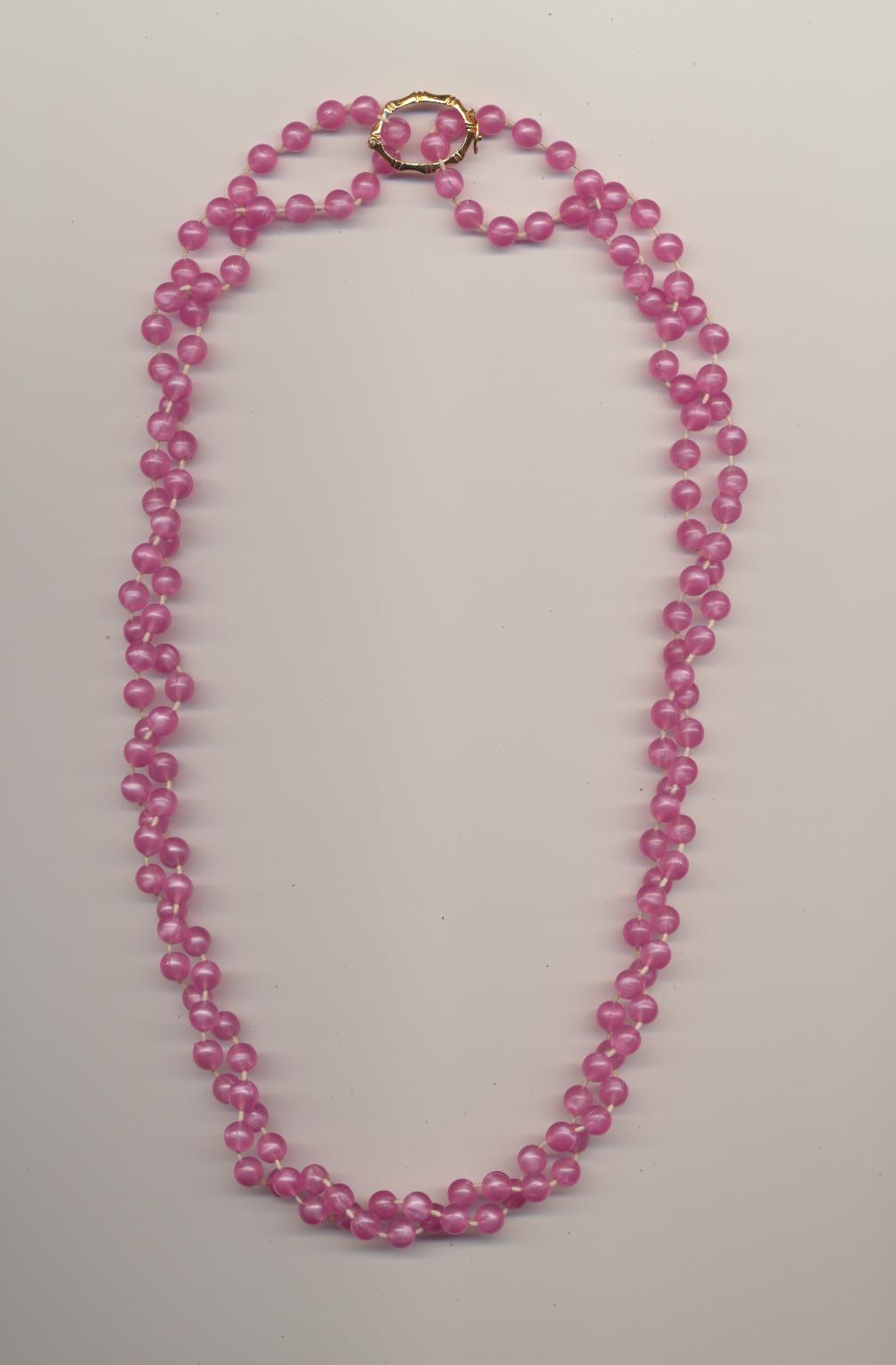 A Twisted Double Strand Bead Necklace Made Of One Necklace And A Pearl Shortener