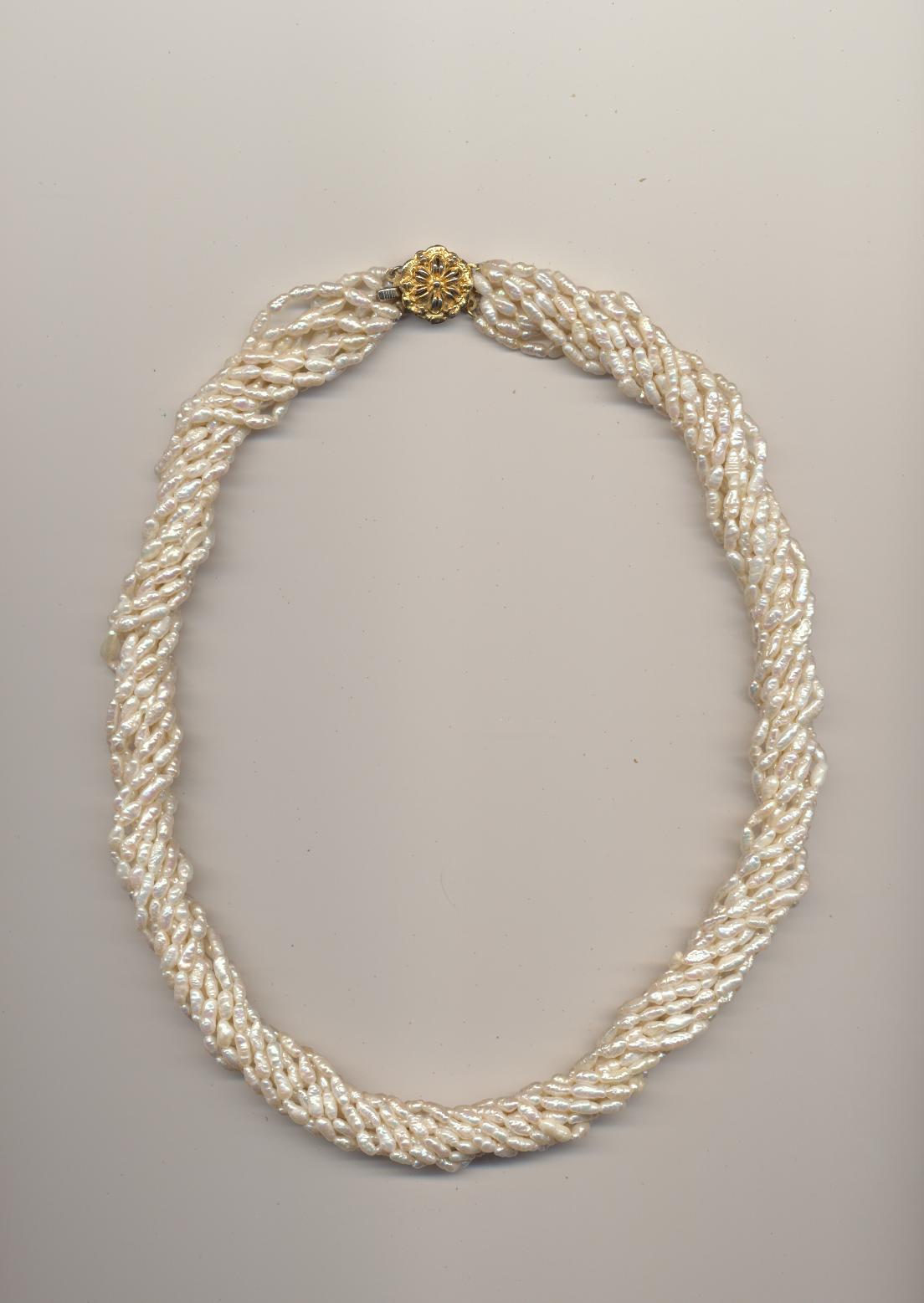 A Twisted Necklace Made Of 10 Strands Freshwater Pearls Of The Same Length