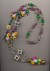 Richly beaded jester necklace made of plastic beads in the traditional Mardi Gras colors of purple, green, gold, Mardi Gras Parade 1996, New Orleans, length 37'' 94cm.